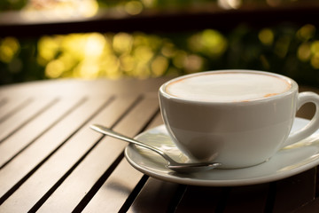 Cup of fresh coffee  break  on wooden table.