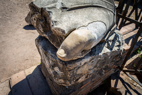 Closeup of a toe on a large broken ancient statue at the Roman Forum italy.
