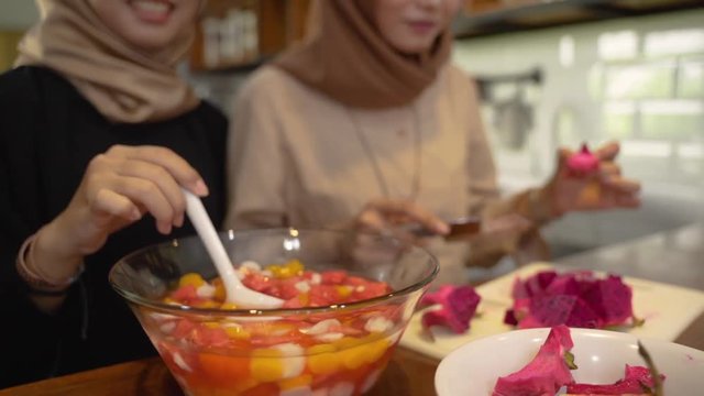 women hijab prepare fresh drink cocktail in the kitchen for breaking fast in ramadhan