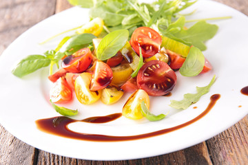 tomato salad with sauce and basil
