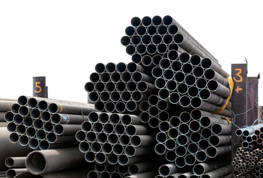 Metal rolling. A round tube are stacked in storage for sale and loading in stock. View from the front, end view, close-up.