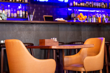 brown leather armchair and table on reustarant