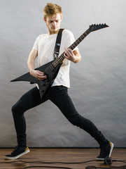 Fototapeta premium Man playing on electric guitar