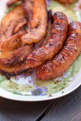 Unhealthy but tasty grilled sausages and meat