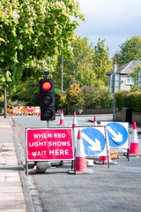 A sight to frustrate every driver - temporary traffic lights at red holding up your journey just as you are in a hurry