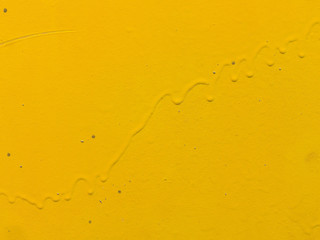 background image smudges of yellow paint and rust on metal