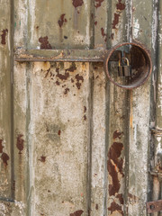 the background image of a rusty door and a padlock