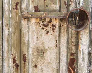 the background image of a rusty door and a padlock