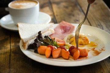 American breakfast with coffee on rustic wooden table. Healthy food for breakfast in the morning ideas concept .