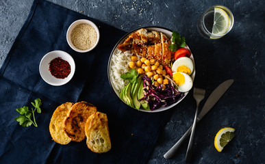 Dinner table buddha bowl Rice chickpeas chicken breast eggs vegetables top view