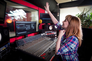 Sound recording studio mixing desk, sound engineer or music producer working at new song