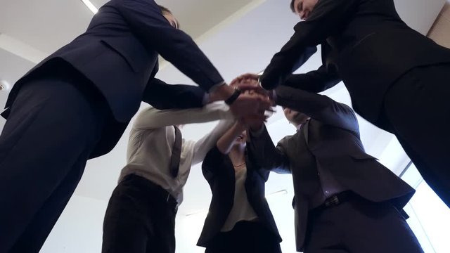 Business people group joining hands for friendship and teamwork concept.