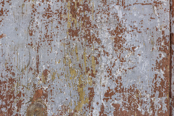 Cracked weathered blue painted wooden board texture.