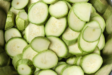 Sliced zucchini fill the entire field of the frame.