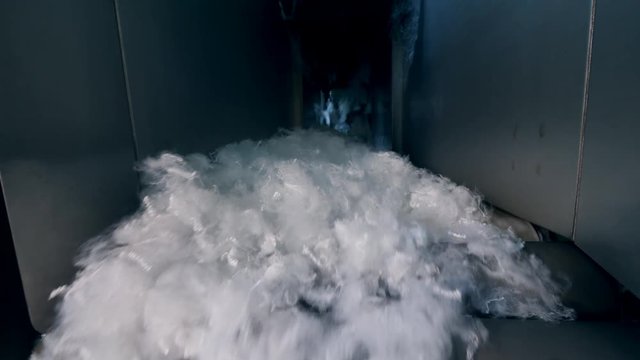 Soft nonwoven fabric moves on a working line at a factory.