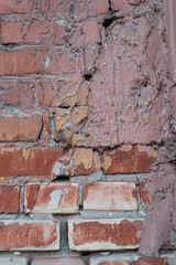 The brick texture, wall, with cracks and scratches can be used as a background