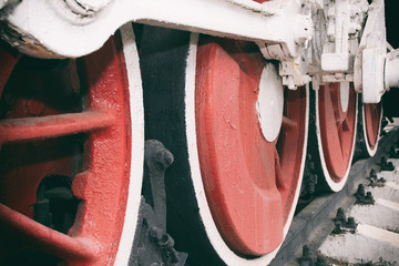 Retro steam locomotive wheels and rods. Details of mechanical parts, wheels and equipment of the train.