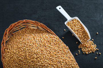  wheat in wooden bowl on wooden background