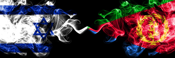 Israel vs Eritrea smoky mystic flags placed side by side. Thick colored silky smokes flag of Israel and Eritrea