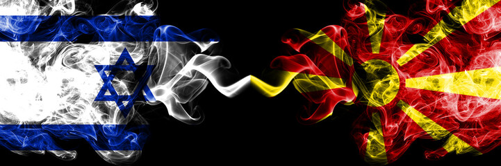 Israel vs Macedonia, Macedonian smoky mystic flags placed side by side. Thick colored silky smokes flag of Israel and Macedonia, Macedonian