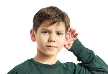 Little boy with hearing problem on white background