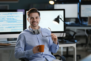 Portrait of male programmer in office