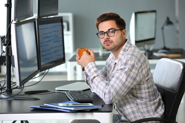 Portrait of male programmer in office