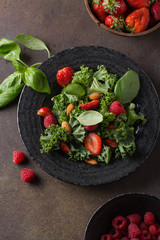 Vitamin green salad with strawberry and  raspberry