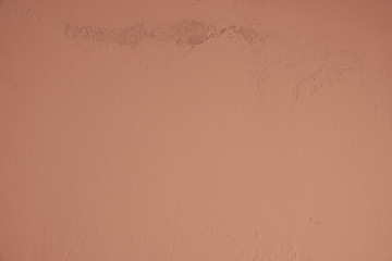Rotbraune verputzte Betonwand mit alten rauen Stellen im oberen Bildbereich. Hintergrund, Textur, gestalterisches, abstraktes Element, Kunst im Industrial Style,  Tapete, Steinwand, Betonwand, Zement