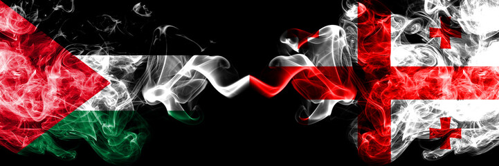 Palestine vs Georgia, Georgian smoky mystic flags placed side by side. Thick colored silky smokes flag of Palestinians and Georgia, Georgian