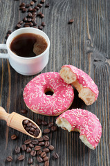 Fresh pink donuts and coffee