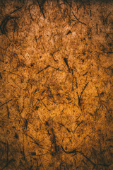 Dark brown texture and background made with recycled paper.   