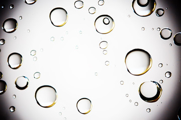 white isolated background water drops on the glass / wet window glass with splashes and drops of water and lime, texture autumn background
