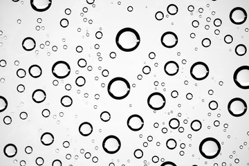 white isolated background water drops on the glass / wet window glass with splashes and drops of water and lime, texture autumn background