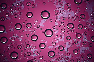 purple wet background / raindrops for overlaying on window, weather, background drops of rain water on glass transparent