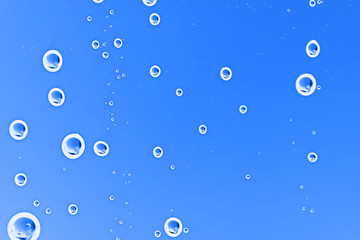 fresh drops background blue glass / wet rainy background, water drops transparent glass blue
