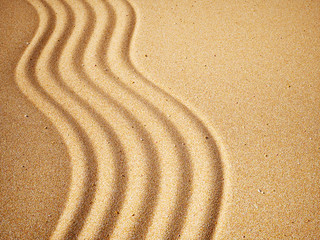 Fototapeta na wymiar Wave of sand pattern background texture