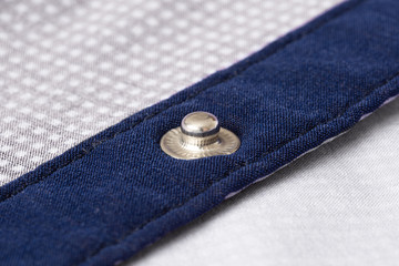 Fastener on shirt closeup.