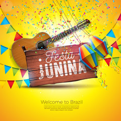 Festa Junina Illustration with Acoustic Guitar, Party Flags and Paper Lantern on Yellow Background. Typography on Vintage Wood Table. Vector Brazil June Festival Design for Greeting Card, Invitation