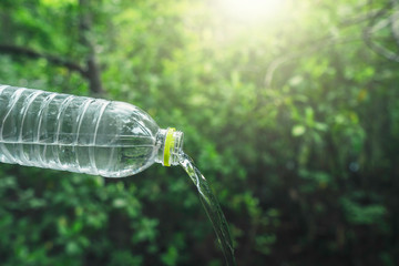 drinking water and natural green background with copy space