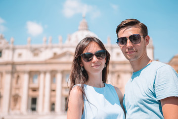 Happy couple at St. Peter's Basilica church in Vatican, Rome.