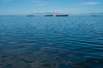 Transport ships on sea horizon