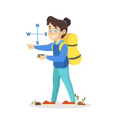 Little girl scout with a backpack looking at the compass