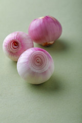 red onions on wooden board