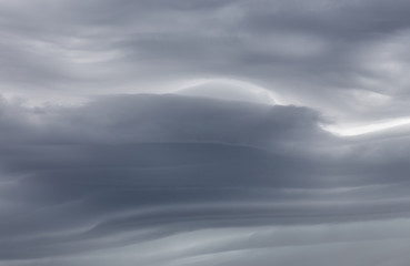 Naklejka na ściany i meble Sky background with dramatic dark clouds. Sky texture photo with storm clouds
