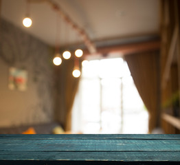 Empty wooden table in front of abstract blurred background of coffee shop . can be used for display or montage your products.Mock up for display of product