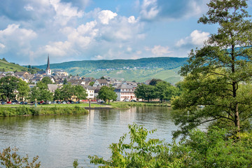 Fototapeta na wymiar Landscape of the Mosel valley and river with a picturesque village, Germany