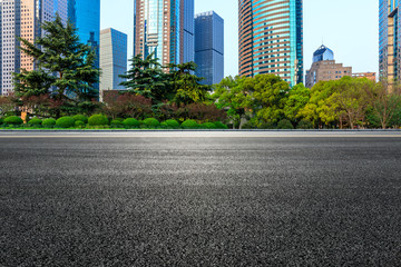 Fototapeta na wymiar Shanghai modern commercial office buildings and empty asphalt road