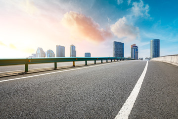 Empty highway and modern city skyline in Shanghai