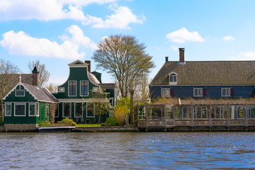Fototapeta na wymiar Zaandam, The Netherlands, April 11, 2019: Houses located on the Oude Haven in Zaandam